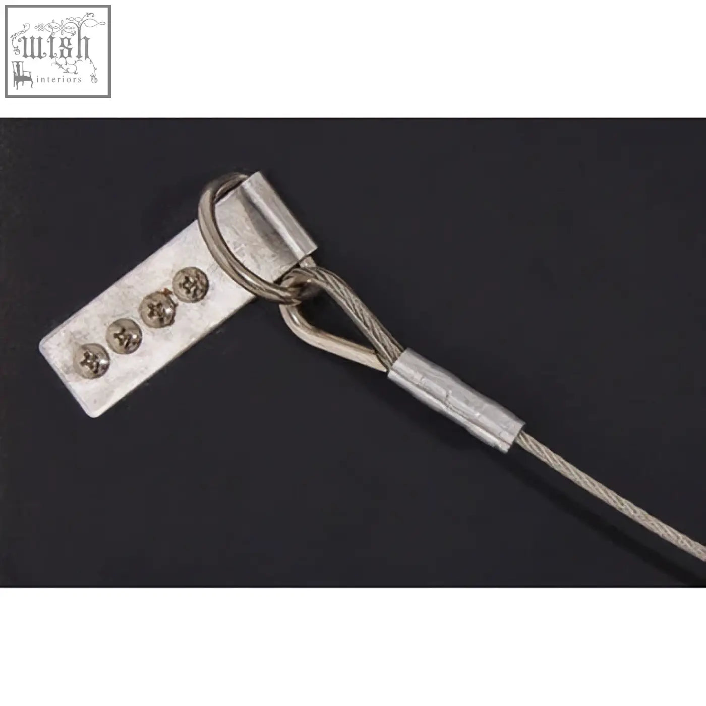 Silver metal cable tie with rectangular plate and screw holes on back of kensington townhouse wall mirror