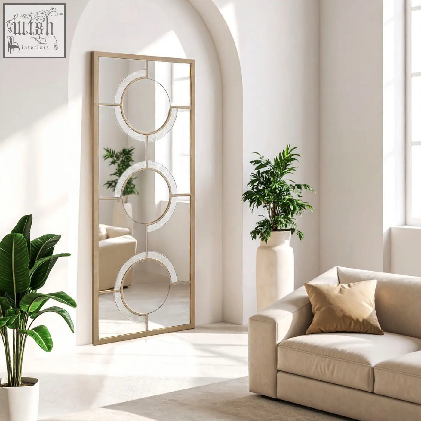 A kensington townhouse wall mirror with a gold-toned frame and three overlapping circular glass panels