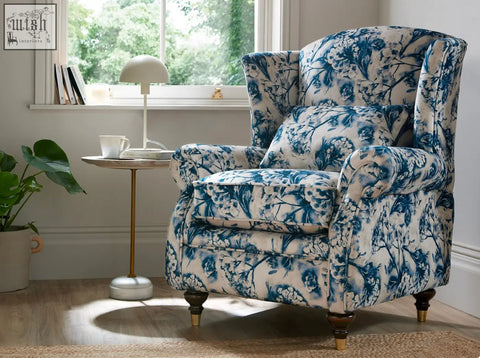 Blue and white floral patterned wing chair with wooden legs perfect for cozy living room seating