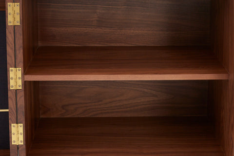 Dark brown kenso sideboard with gold metal hinges and deep central drawer in natural sideboard style