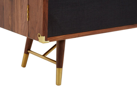 Kenso sideboard with rich walnut finish, black textured panel, brass accents, and a deep central drawer natural sideboard