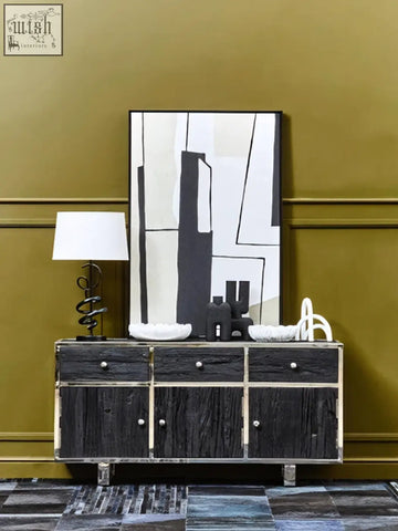 Kerala black sideboard with black rustic wood, metal hardware, and stainless steel legs for stylish storage