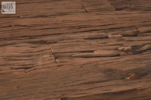 Close-up of reddish-brown layered rock texture on the base of kerala natural u shaped base dining table