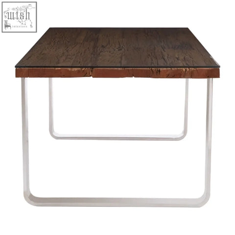 Kerala natural u shaped base dining table with a dark brown wooden top and slender chrome base dining table legs
