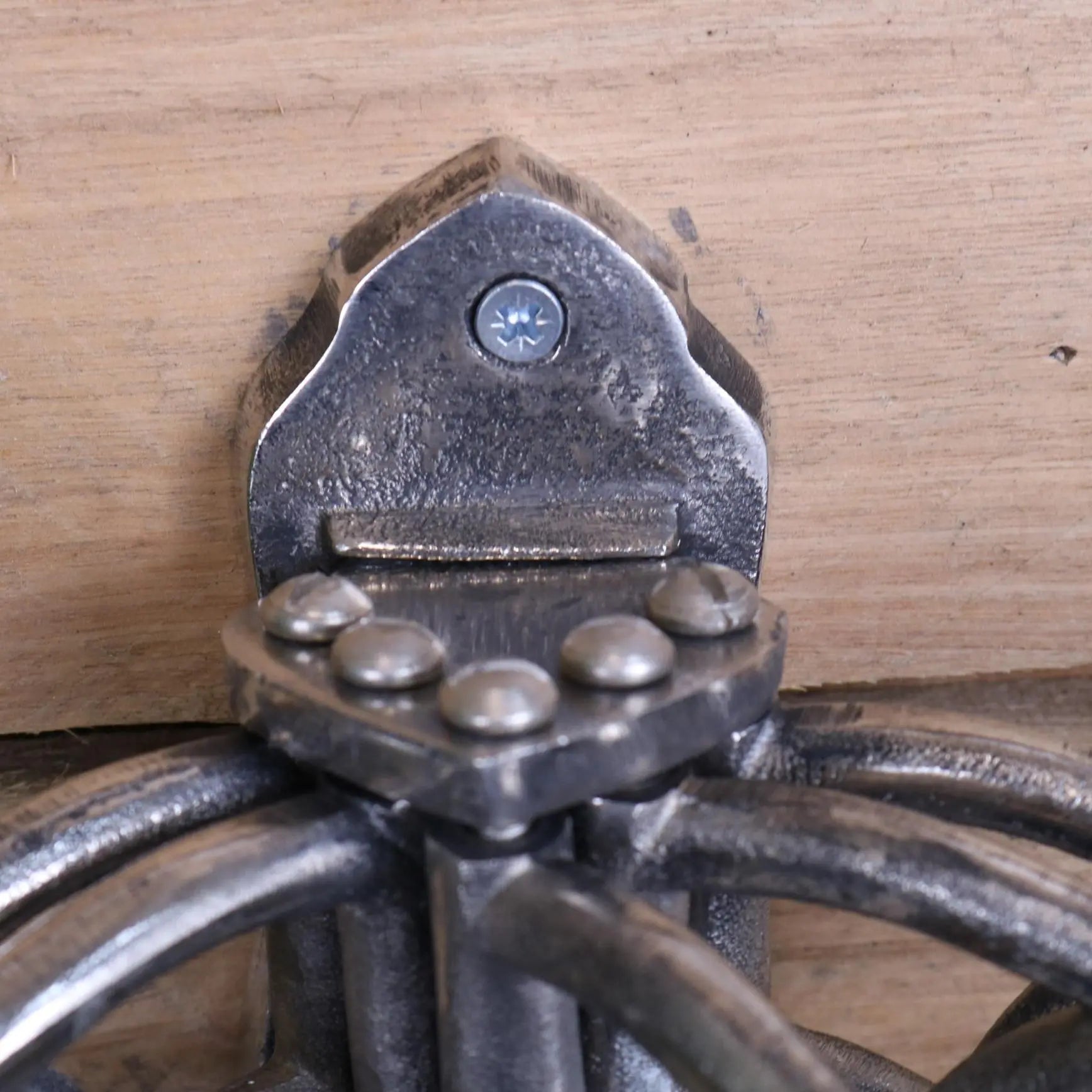 Forged black metal wall-mounted candle holder with gothic design and decorative rivets fits kesda captains swivel hooks