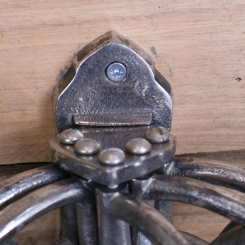Forged black metal wall-mounted candle holder with gothic design and decorative rivets fits kesda captains swivel hooks