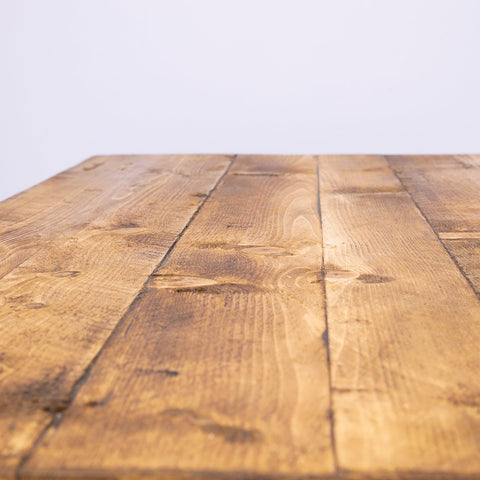 A keswick coffee table made of solid wood with drawers and a warm natural finish perfect for cozy living spaces