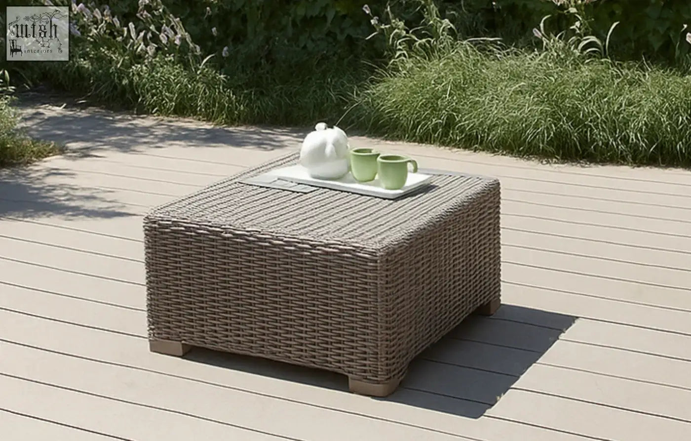 Woven gray taupe rattan coffee table by keter california taupe with rectangular tray holding white teapot and green mugs