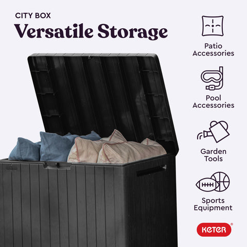 Keter city 30 gallon dark grey resin storage box with vertical ridges and hinged lid doubles as patio table with storage capacity