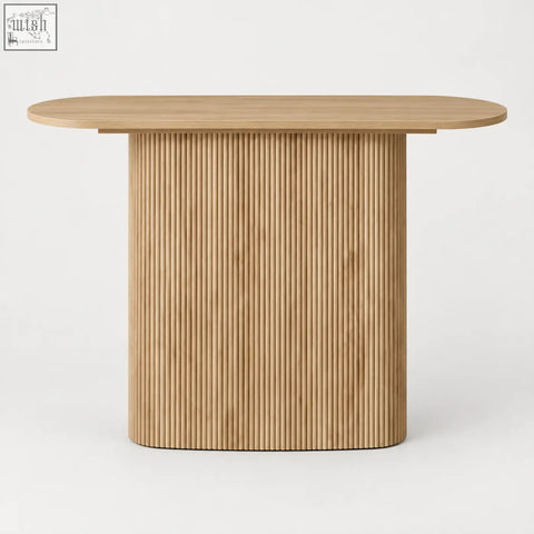 Light wood oval dining table with sleek close vertical fluting on oak-effect ribbed base for modern dining spaces