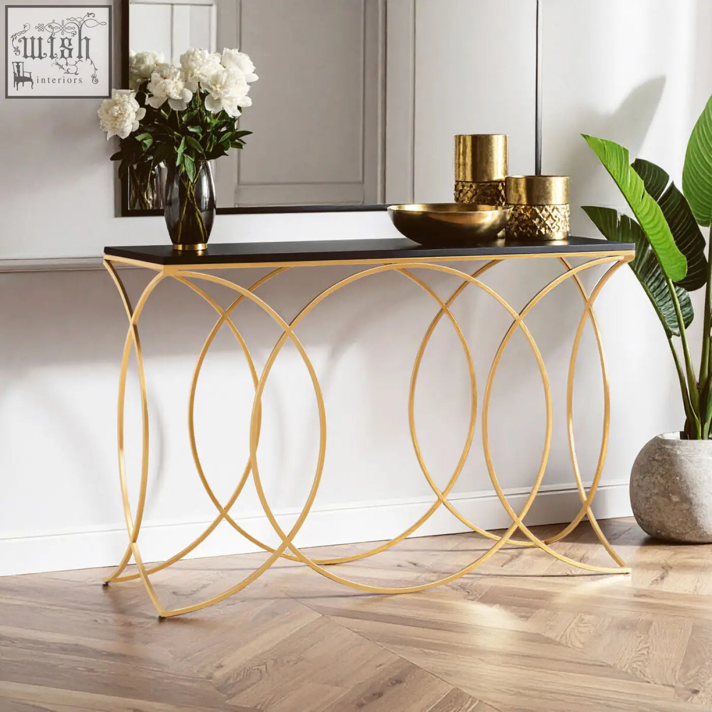 Kia black and gold console table with gold metal frame black marble top and interlocking circular legs gold console table