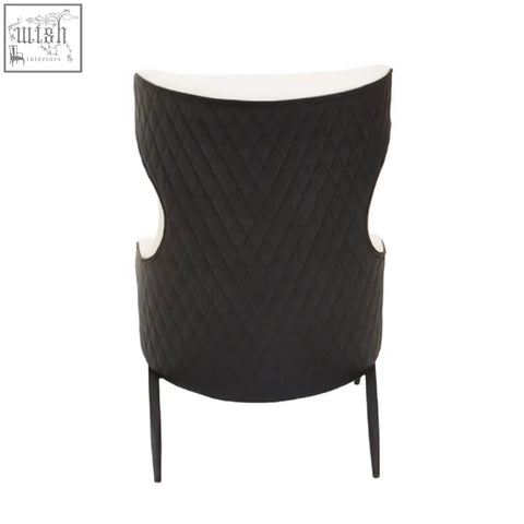 Black quilted kiev ivory armchair with white faux leather lining and sleek metal legs for stylish seating
