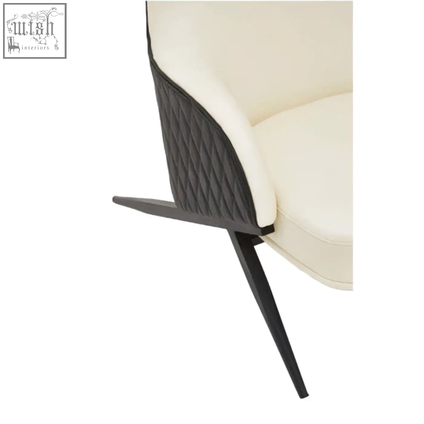 Cream-colored faux leather kiev ivory armchair with black quilted accent panel and sleek tapered legs