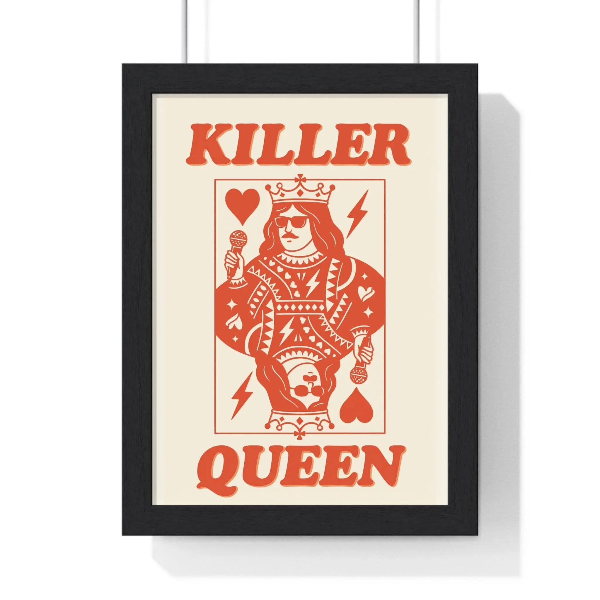 A framed killer queen poster with a stylized orange playing card design featuring bold typography and intricate patterns