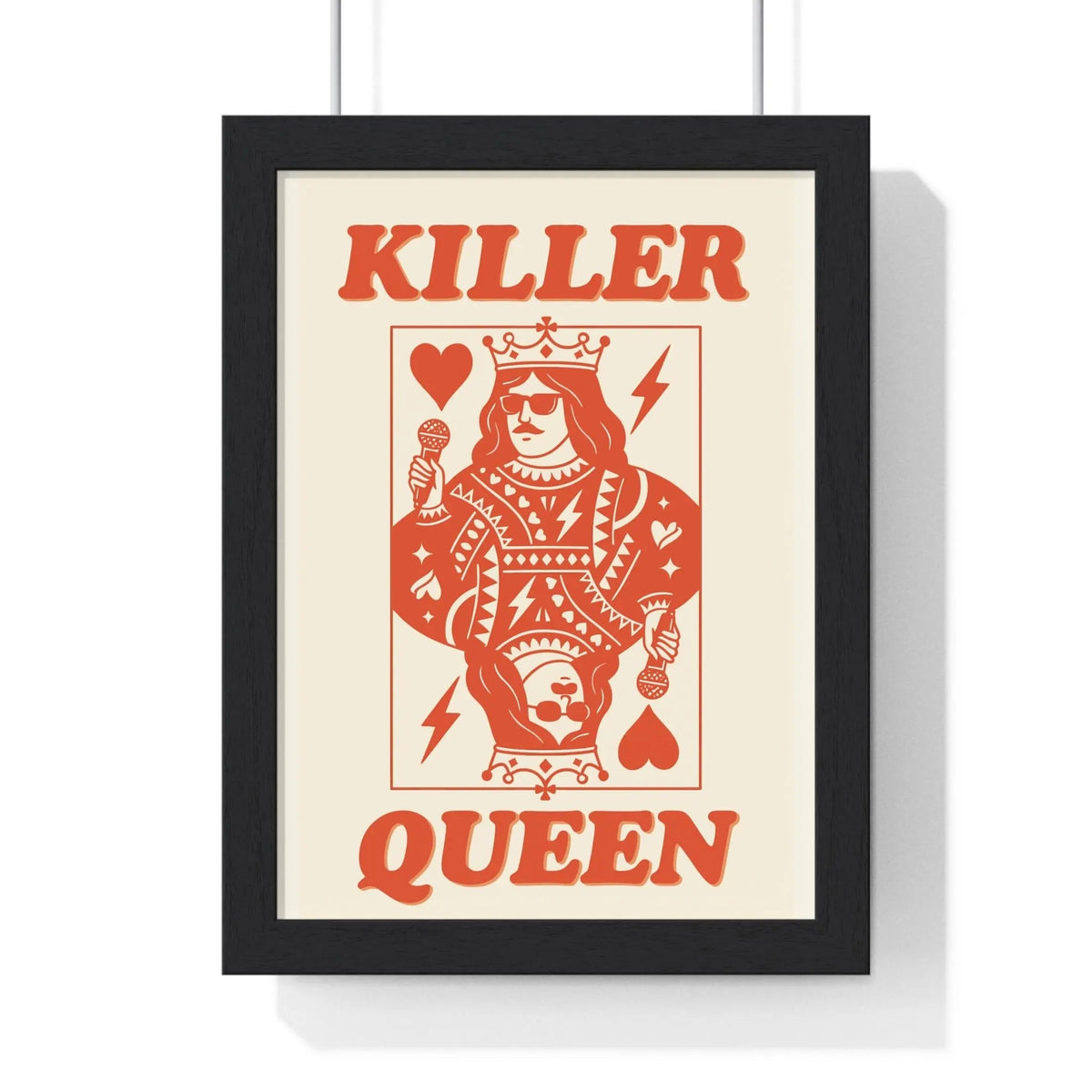 A framed killer queen poster with a stylized orange playing card design featuring bold typography and intricate patterns