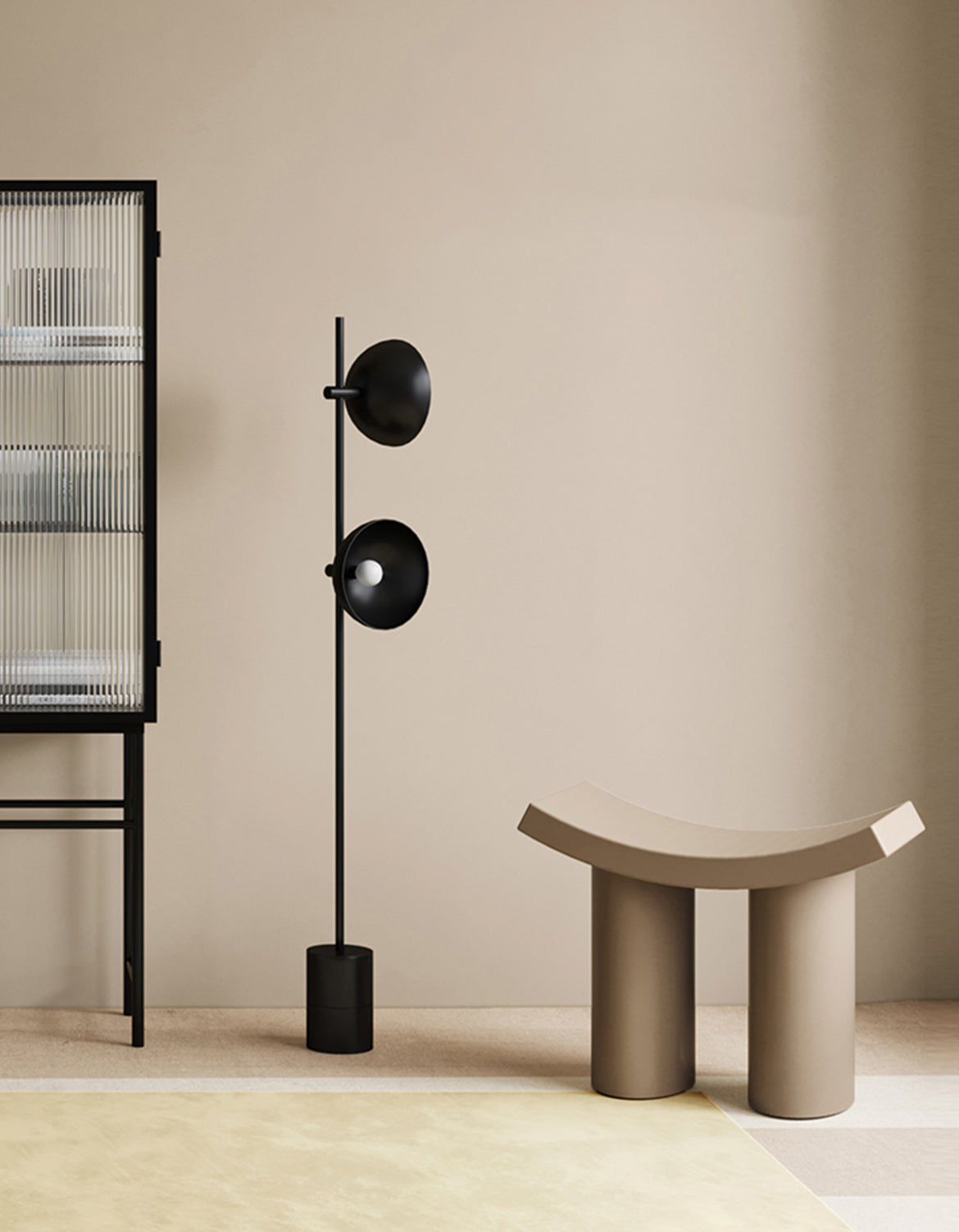 Black floor lamp with two circular shades and slender pole next to kimber footstool dressing table stool