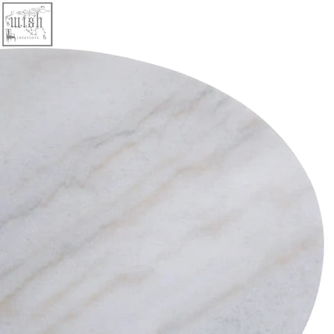 Kindia round white marble lazy susan with subtle gray veining on a smooth white marble tabletop surface