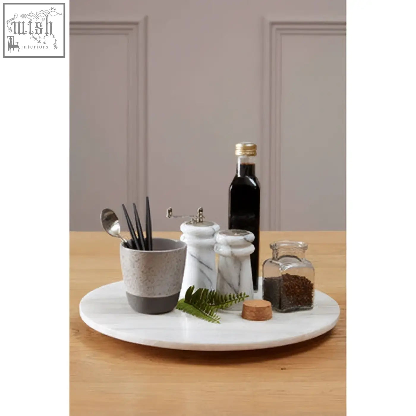 Kindia round white marble lazy susan with a smooth polished surface and subtle veining on a round white marble tray