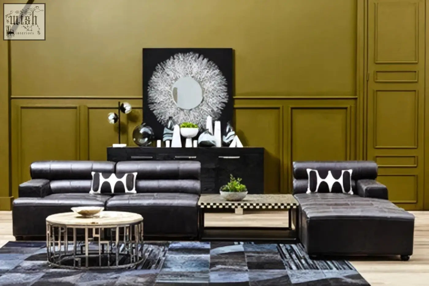King antique black leather modular ottoman with sleek black leather sectional and white geometric throw pillows