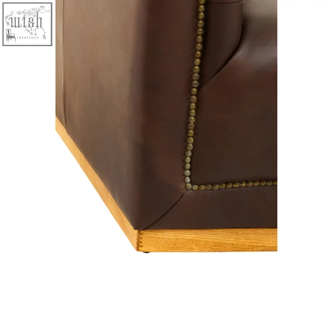 Brown leather armchair with brass nailhead trim and wooden base features genuine leather in dark brown finish