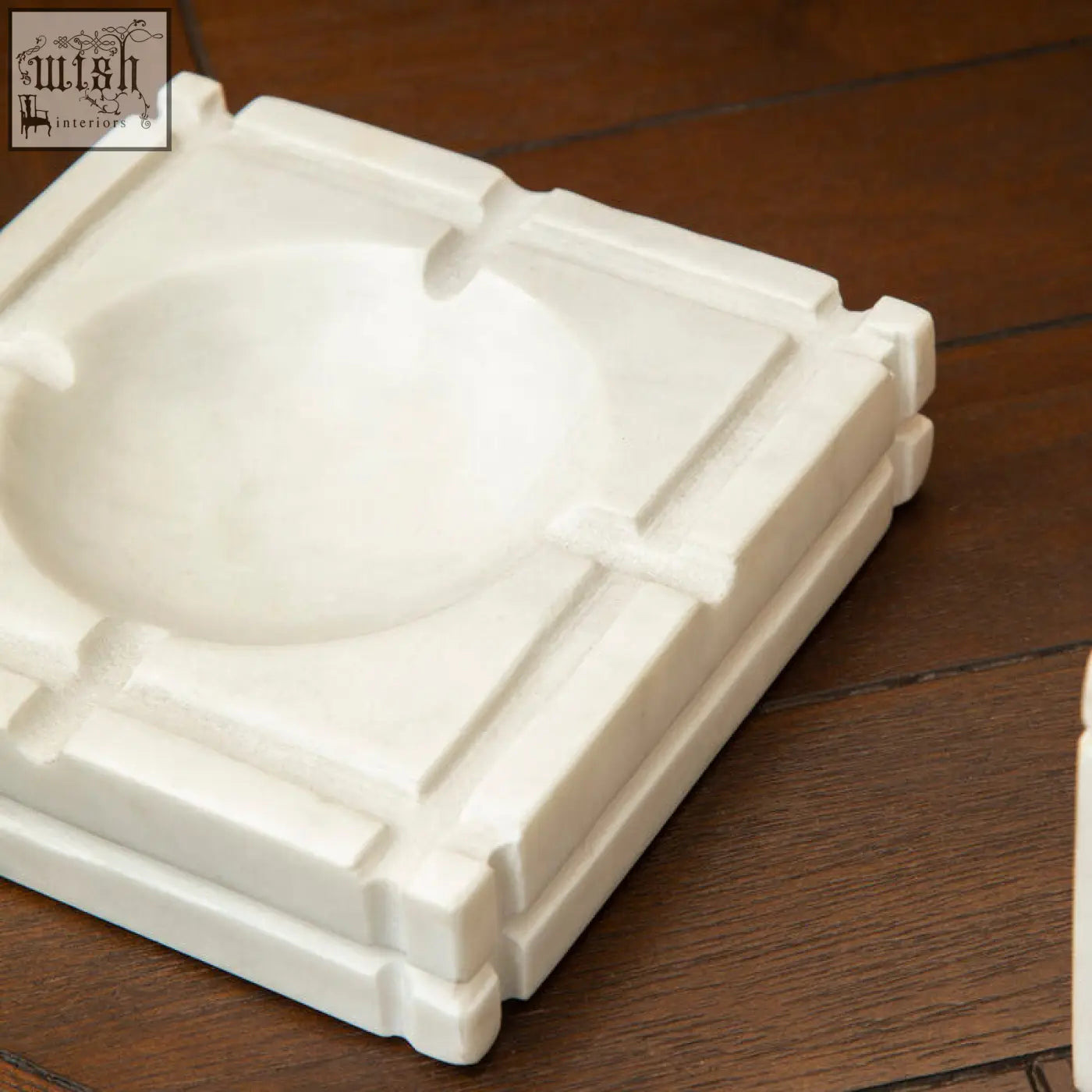 Kira white marble ashtray with a square geometric design and four cigarette slots made of white marble