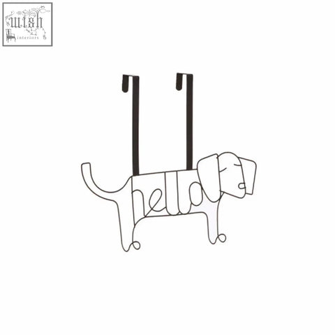 Black wire kirby black sausage dog hanger featuring hello lettering along its body for hanging items