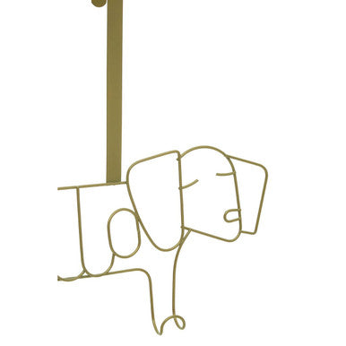 Minimalist kirby gold sausage dog hanger made of gold-toned wire outline hanging from a hook