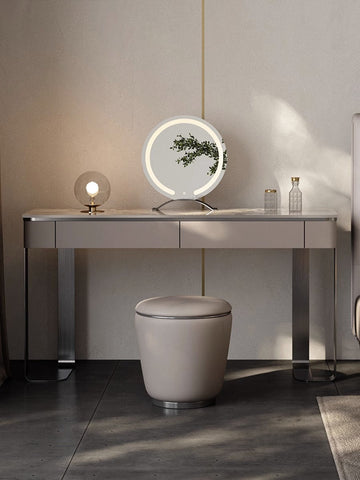 A sleek kirsten dressing table with a marble top led mirror and metallic legs for modern vanity spaces