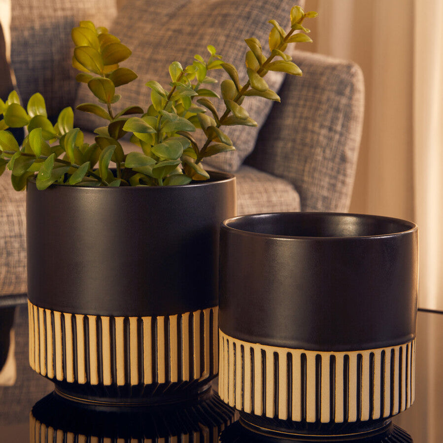 Black ceramic planter with gold vertical stripes at the base kiso large ceramic planter perfect for indoor use