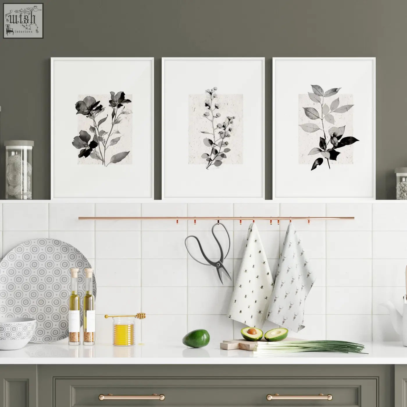 Three framed kitchen art wall prints featuring black and white ink wash floral illustrations in white frames