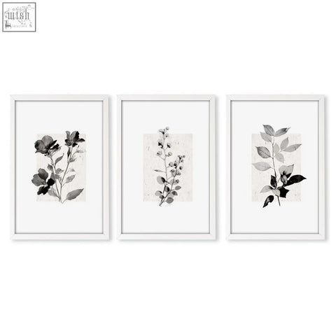 Set of three minimalist botanical kitchen art wall prints with ivory grey floral ink wash in white frames on textured paper