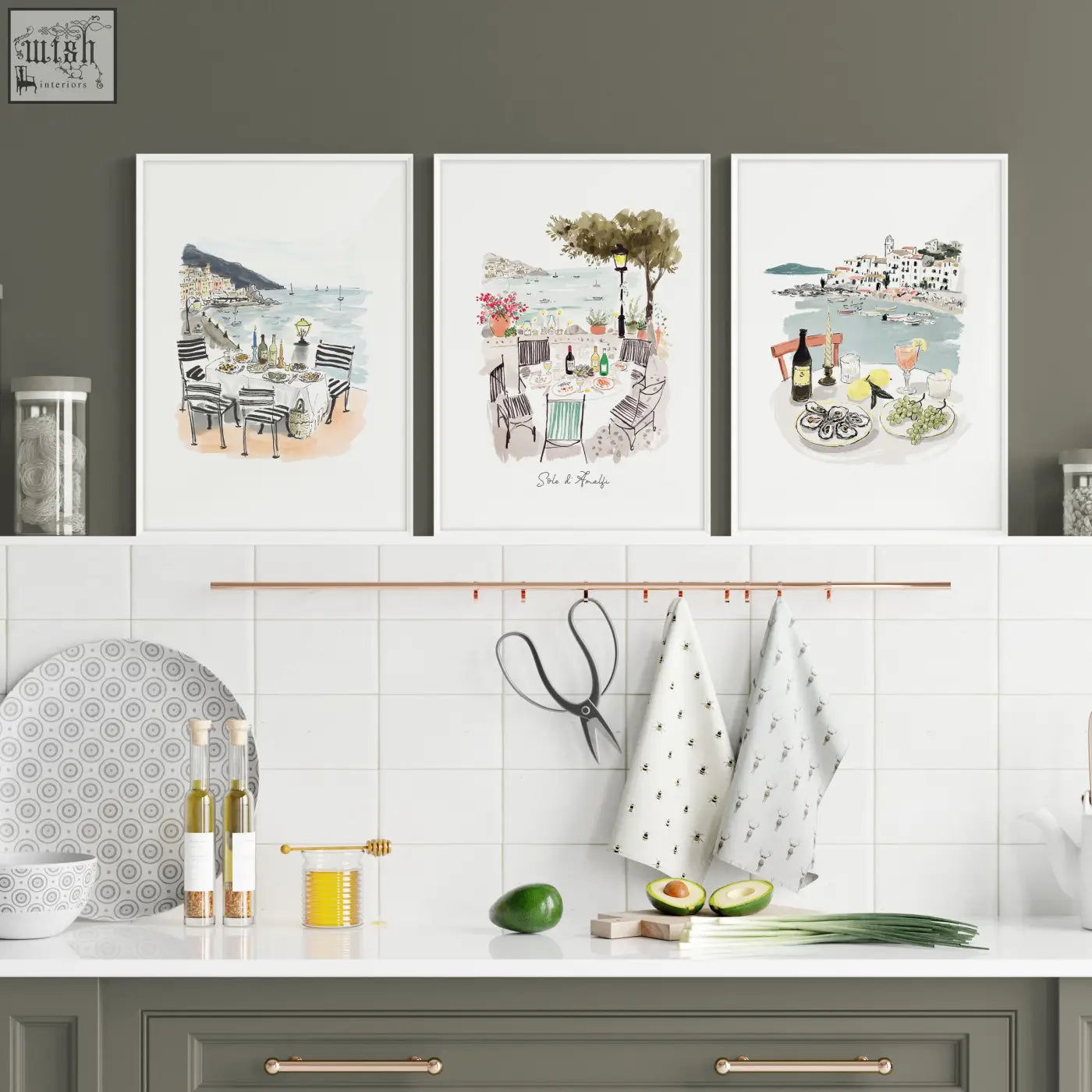 Three framed sole di amalfi kitchen paintings featuring mediterranean coastal watercolor prints above a counter