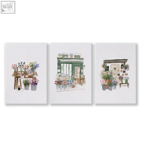 Set of three kitchen prints featuring vibrant flower shop blooms in rustic pots with country cottage pastel storefronts
