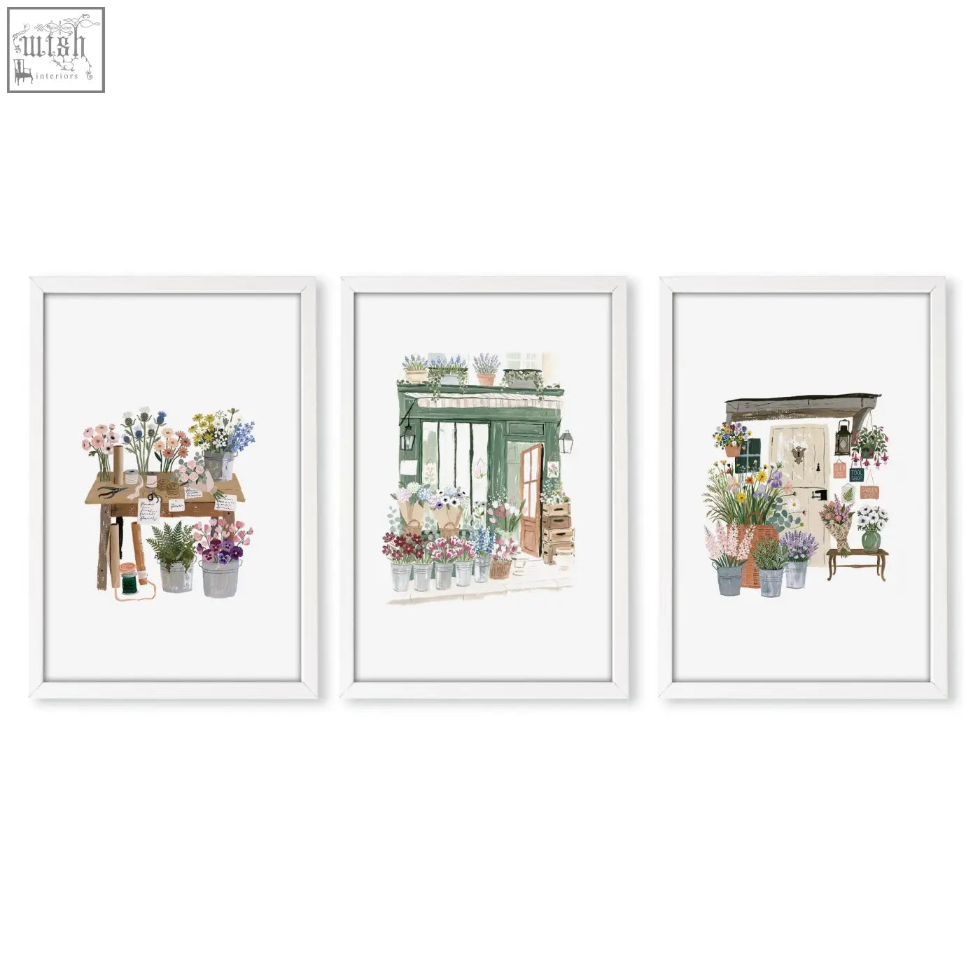 Set of three white-framed kitchen prints featuring charming country cottage flower shop watercolor art with vibrant blooms