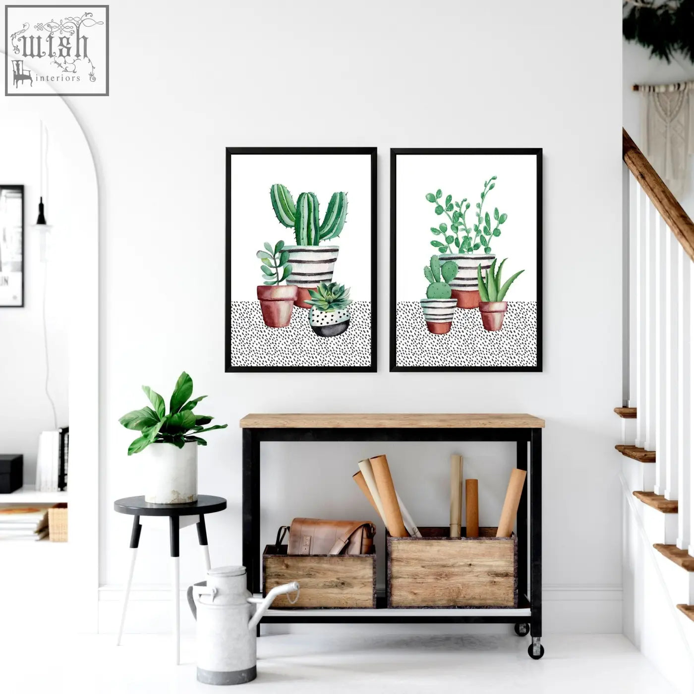 Two framed succulent plants kitchen prints with watercolor cacti in striped and solid pots above a wooden cart