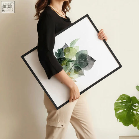 Black-framed kitchen wall artwork with botanical green leaves and gold tones on white background set of 3 prints