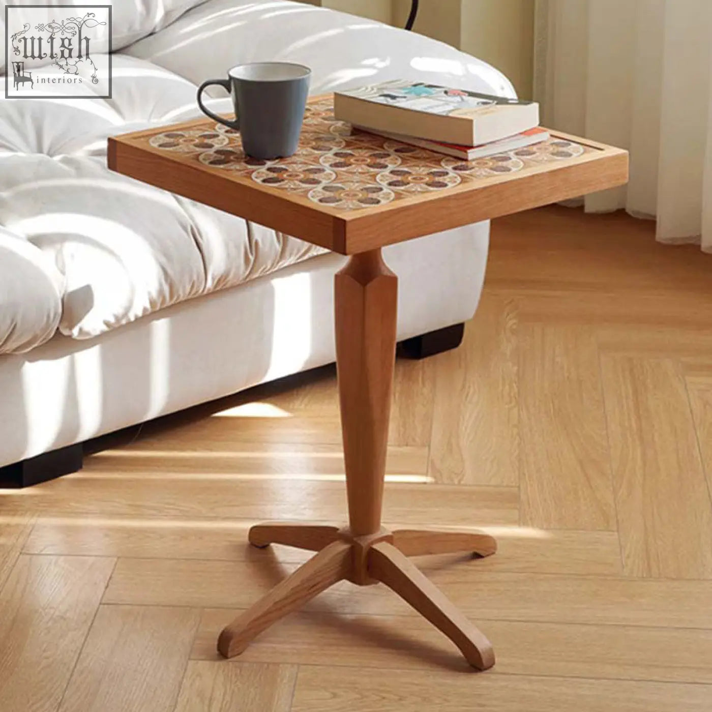 Kitty side table in cherry wood with a light brown finish and intricate mosaic top on a four-footed pedestal base