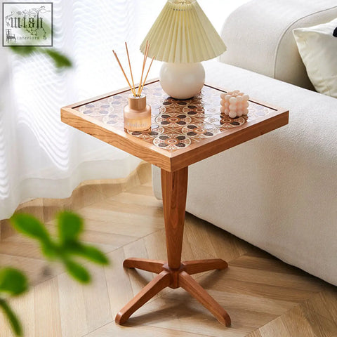 Kitty side table with cherry wood pedestal base and brown beige mosaic tile top featuring circular patterns