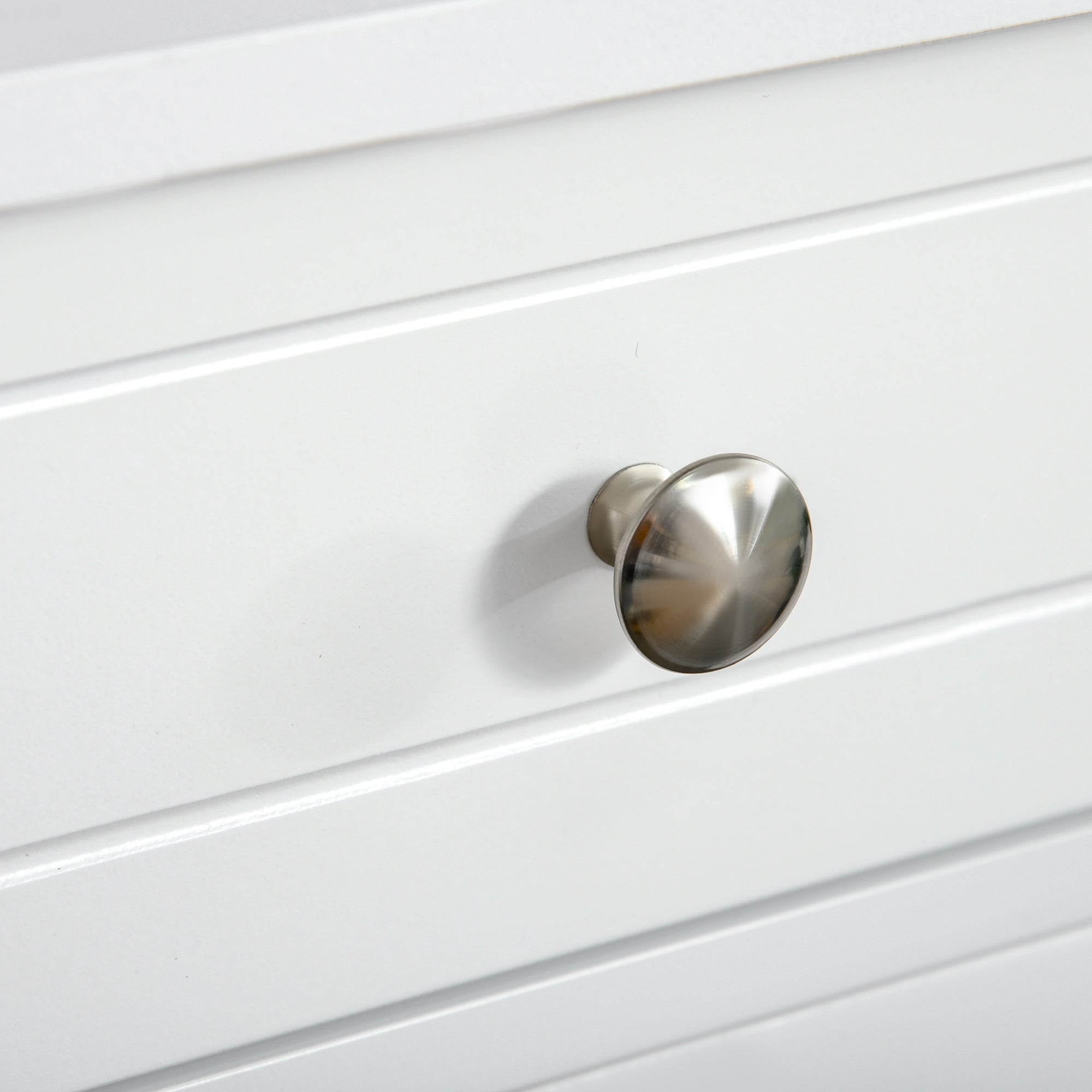 Shiny silver round metal handle on white kleankin bathroom cabinet with two drawers and adjustable shelf
