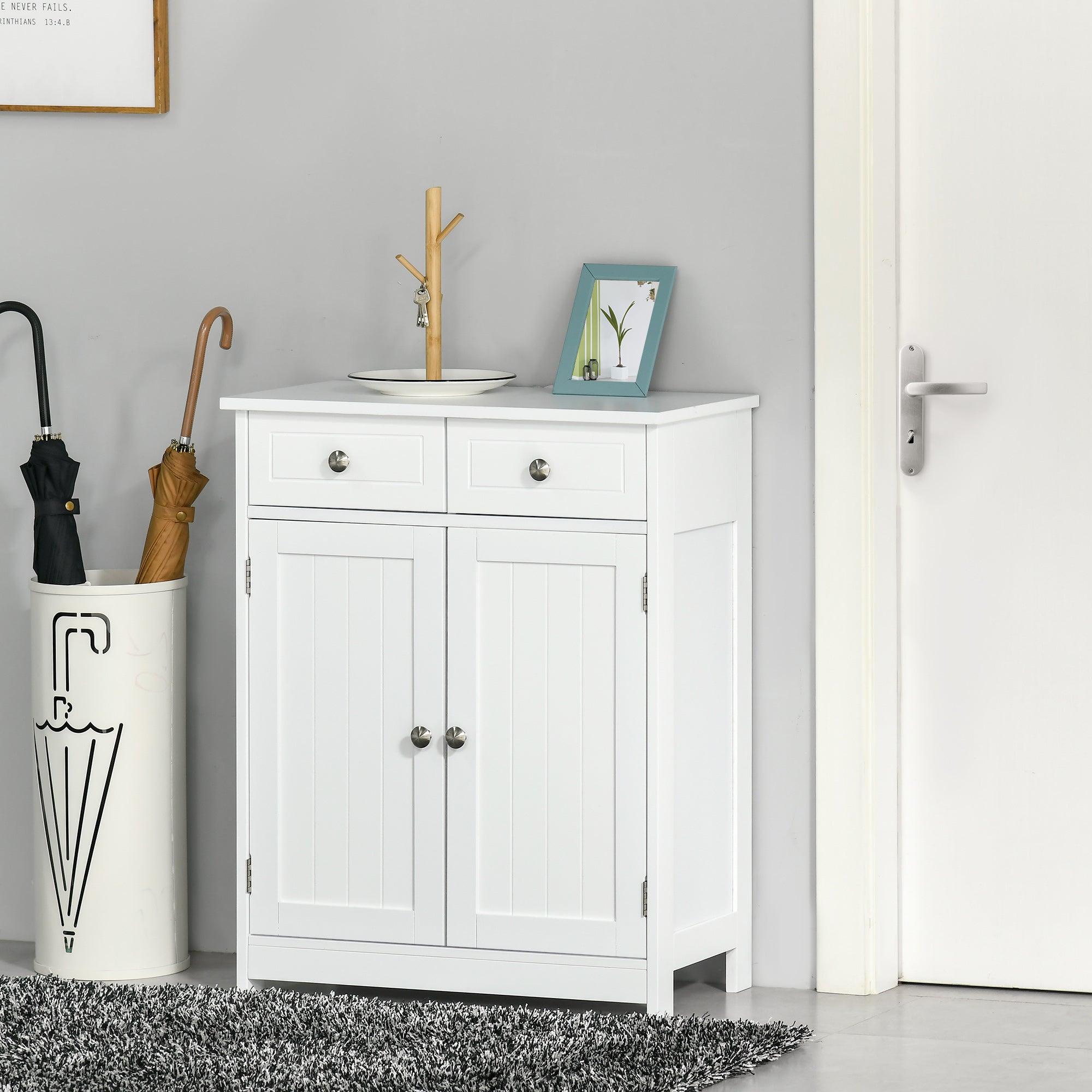 White wooden bathroom cabinet with two drawers, adjustable shelf, silver knobs, and metal handles in traditional style