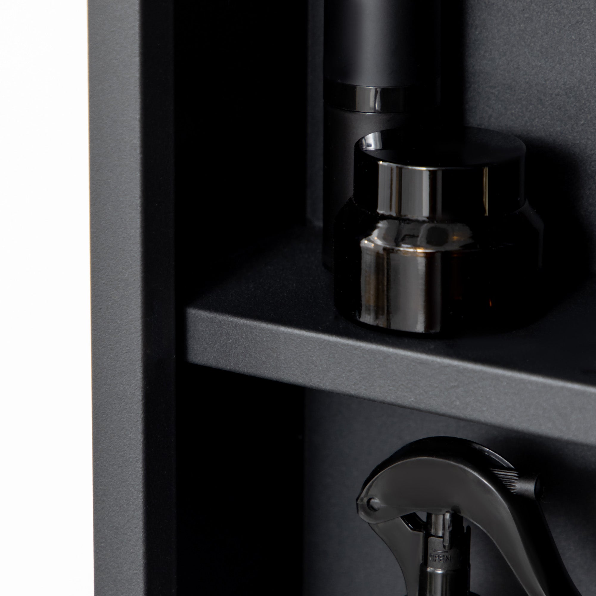 Black matte metal coffee grinder with chrome top cap next to kleankin black stainless steel mirror bathroom cabinet