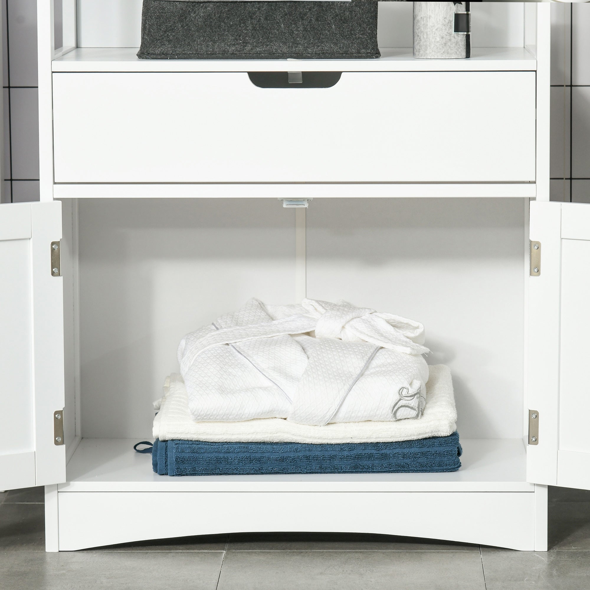 White wooden kleankin bathroom floor cabinet with open doors showing neatly folded blue and white towels inside