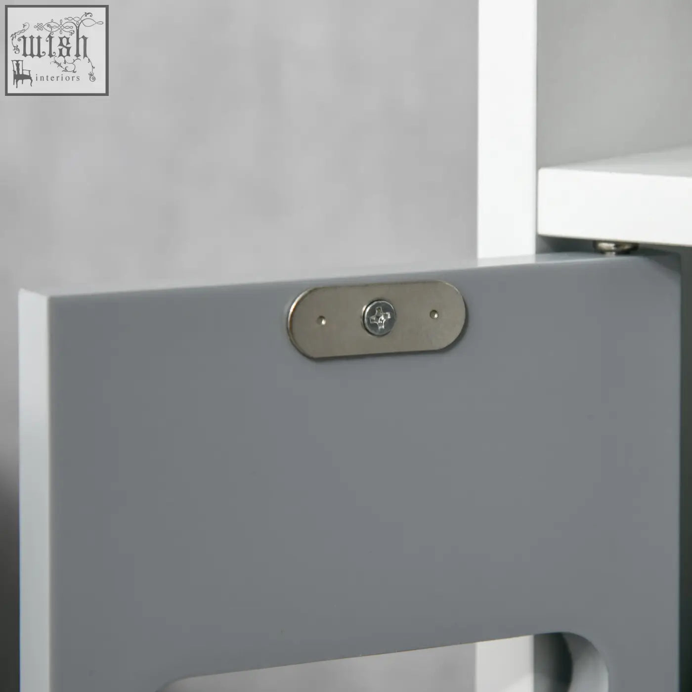 Gray bathroom storage cabinet door with sleek metallic hinge plate and open shelves for modern storage needs