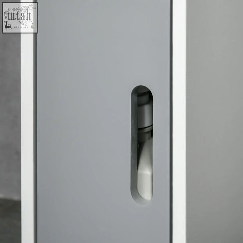 Gray metal bathroom storage cabinet with open shelves and door showing a white pump bottle inside