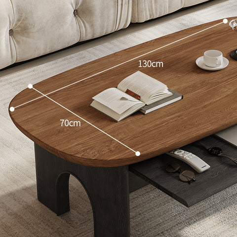 Modern knight coffee table with warm brown wood oval top dark matte legs and integrated storage drawer