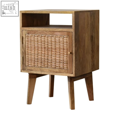 A rustic oak rattan knit door bedside table with a spacious interior and tapered mango wood legs