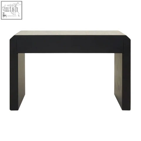 Black rectangular komo console table with matte smooth surface and sturdy blocky legs for modern living space