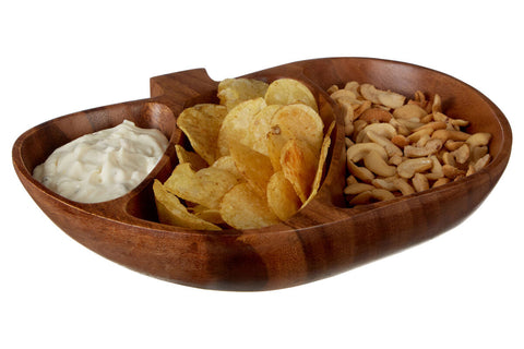 A rich dark brown kora acacia apple-shaped serving dish with three compartments holding chips cashews and white dip