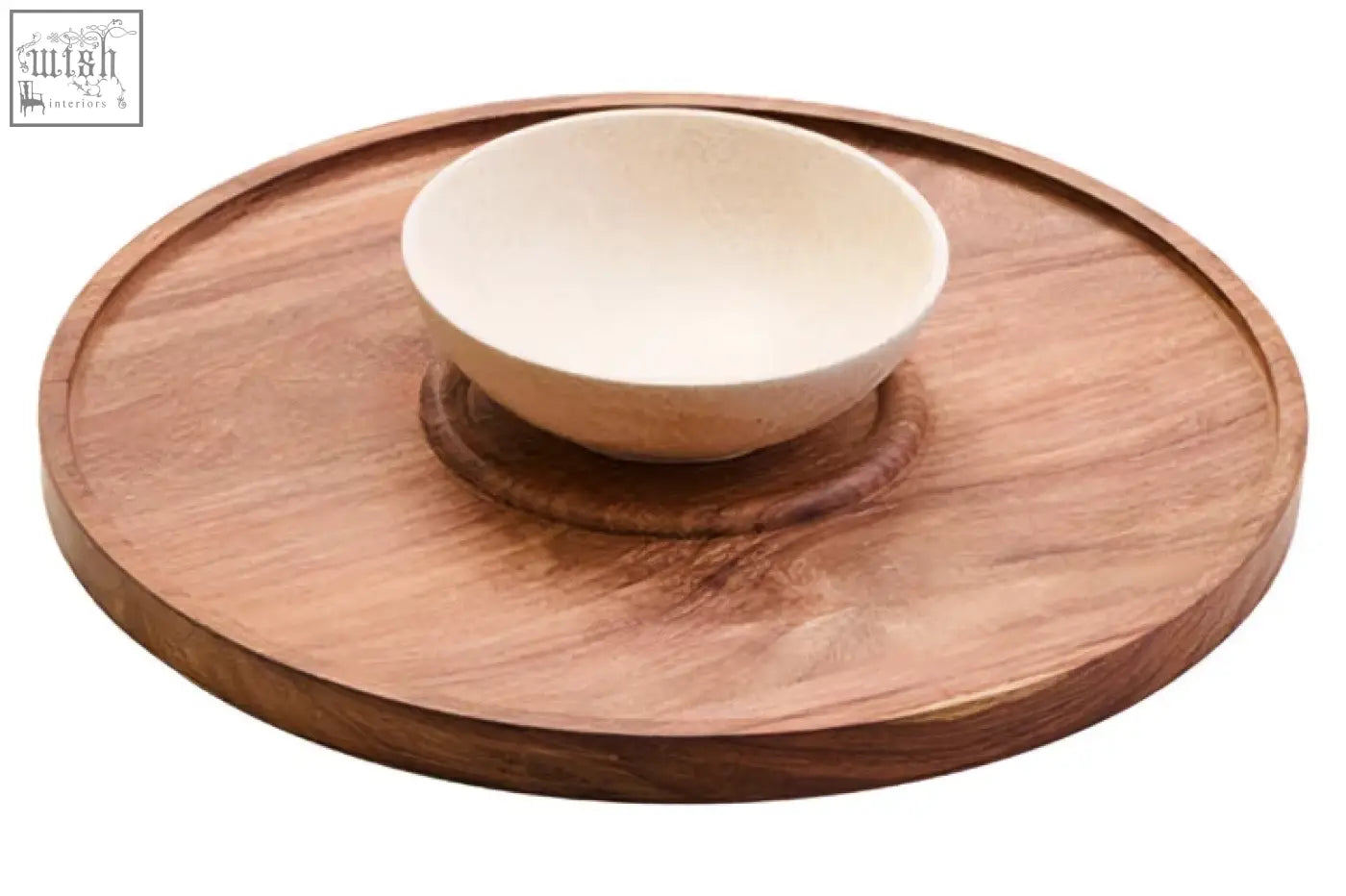 A light brown acacia wood serving tray with a cream marble chip bowl centered on its circular surface