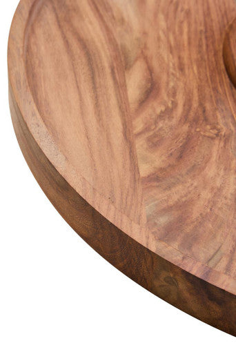 A round acacia wood chip and dip platter with a smooth polished surface and natural wood grain patterns